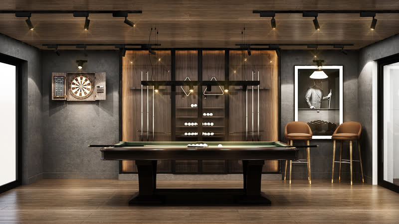 Restaurant interior with a brass-framed bar and dark timber panelling