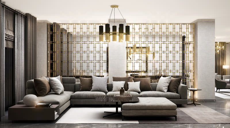 Living room framed by a brass grid screen and deep grey sectional