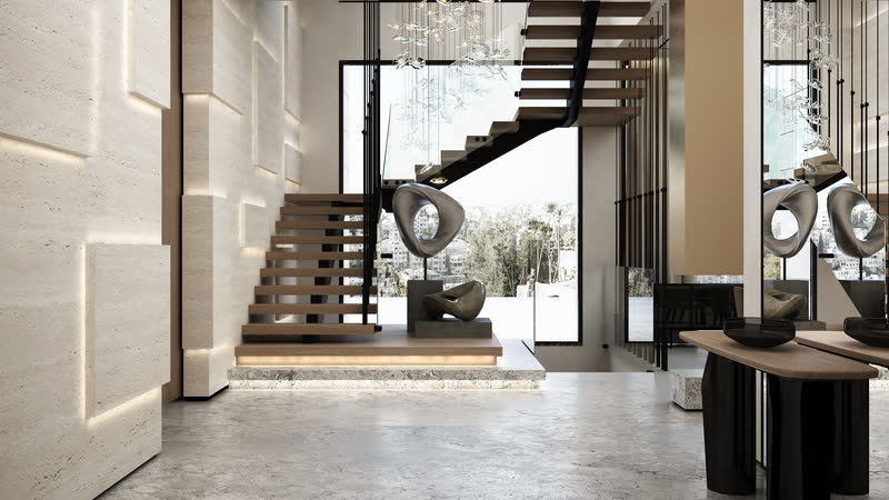 Double-height living space with a floating staircase and full-height glazing